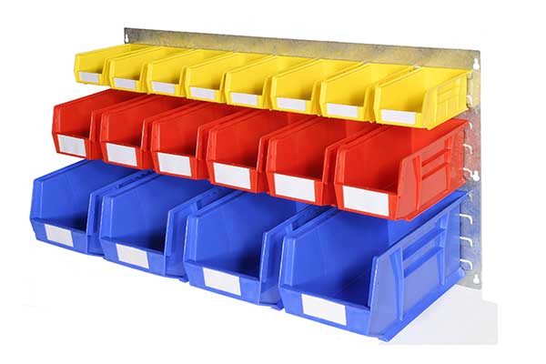 Young Logistic Manager Organizing Boxes In Storage by Stocksy