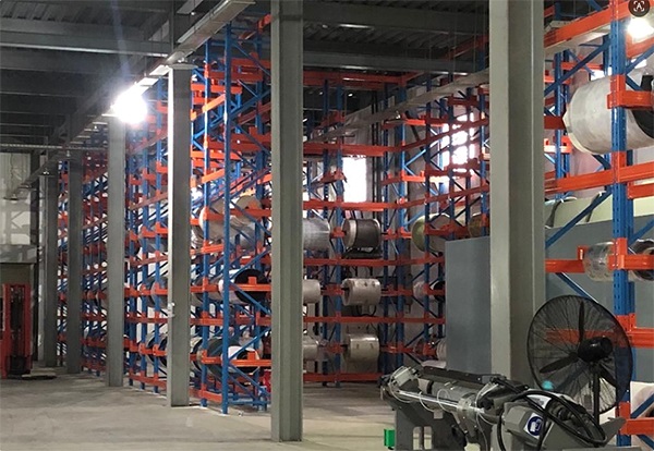 Multi-level roll storage racks for fabric and other rolled materials